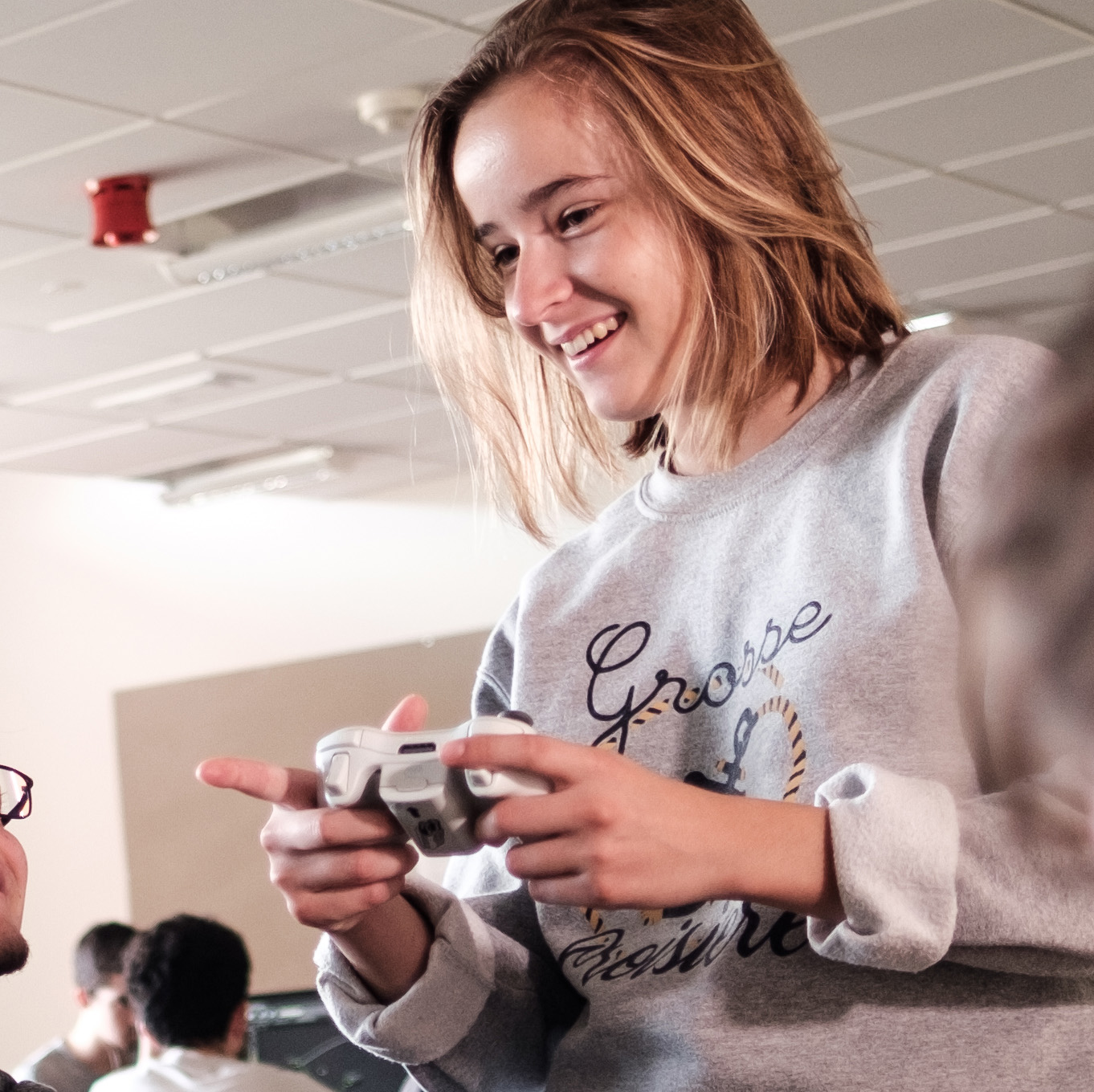 A student tests out a game using a handheld controller