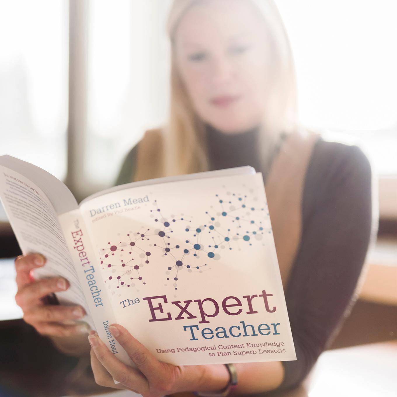 An Education student reads a course textbook - the Expert Teacher
