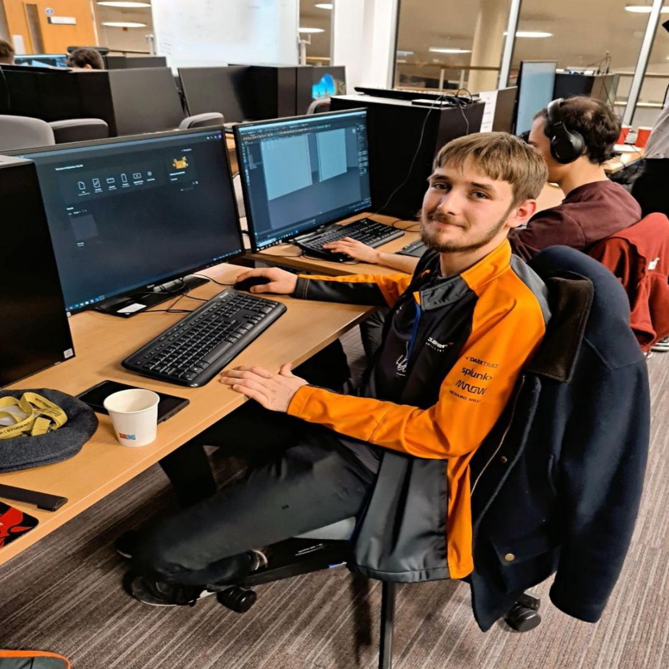 A student sat at a computer